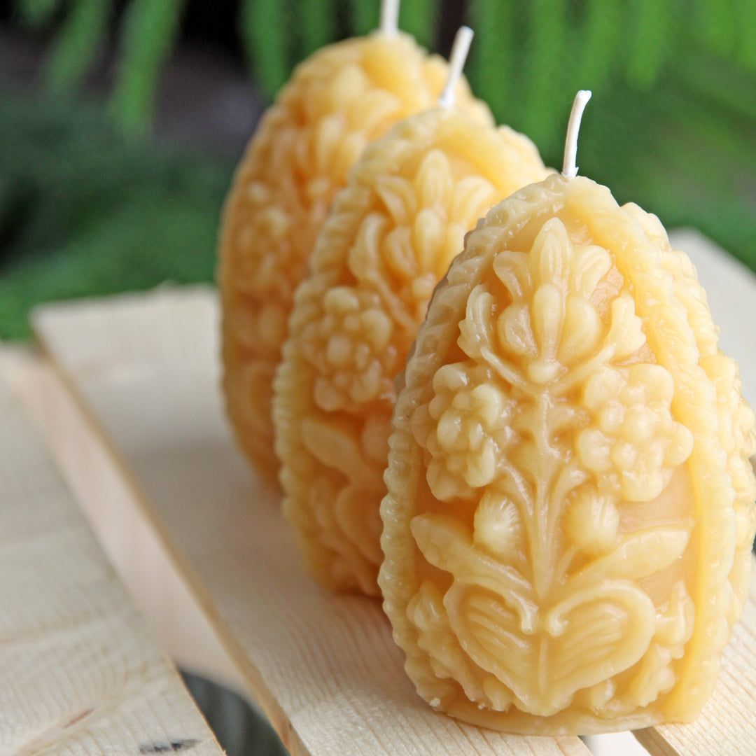 Ornate beeswax egg candle 